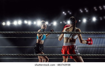 Girls boxing in ring . Mixed media - Powered by Shutterstock