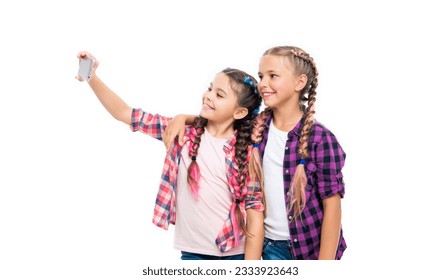 girls children having selfie time. school friends capture fun with selfie. friendship concept. heartwarming friendship selfie. school children making selfie. With smiles and laughter - Powered by Shutterstock