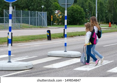 Girls Crossing The Street On The Way To School