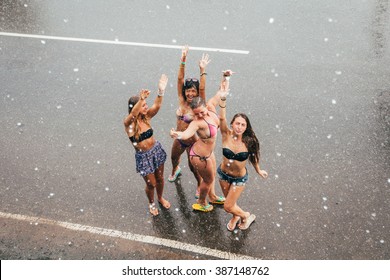Girls dance in the rain