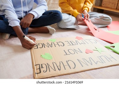 Girls Decorating Placard They Made For Climate Change Protest