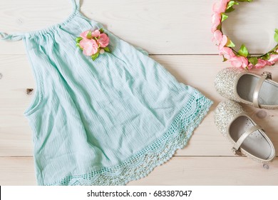 Girl's Dress, Floral Tiara And Shiny Shoes On A Wooden Background. Girl's Apparel For Party, Top View