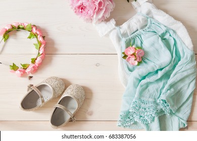 Girl's Dress, Floral Tiara And Shiny Shoes On A Wooden Background. Girl's Apparel For Party, Top View