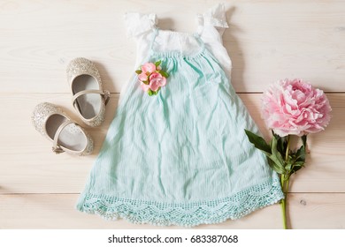 Girl's Dress, Floral Tiara And Shiny Shoes On A Wooden Background. Girl's Apparel For Party, Top View