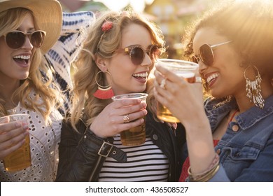 Girls drinking beer at the party