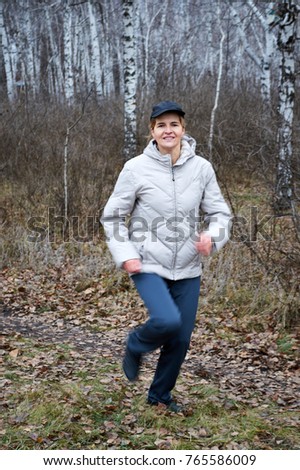 Similar – Active and sporty woman runner in autumn nature