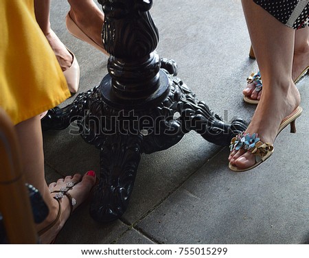 Girls Feet Under A Cafe Table Girls Feet Under A Cafe Table