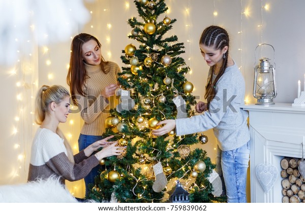Girls Friends Decorating Furtree Near Fireplace Stock Photo Edit