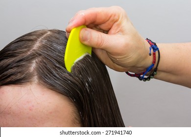 Girls Hair Being Examined And Cleaned For Lice