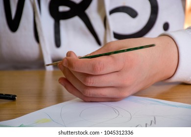 The girls hand drawing on a school bench - Shutterstock ID 1045312336