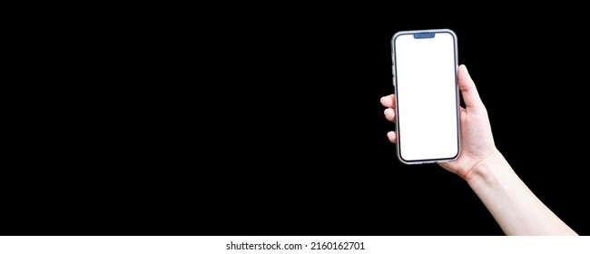Girl's hand holds the phone with a blank white screen on a bright black background. Advertising a beauty salon on a smartphone. Mockup image of a man holding mobile phone with blank desktop screen. - Shutterstock ID 2160162701
