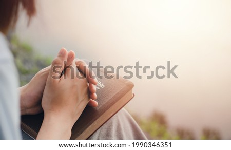 girl's hand sitting praying for god's blessing Along with coming to heal a peaceful life with nature. and the Holy Word