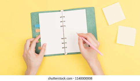 Girl's Hand Writing In Notebook 