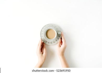 Girl's Hands Holding Coffee Cup. Flat Lay, Top View