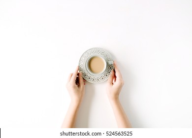 Girl's Hands Holding Coffee Cup. Flat Lay, Top View