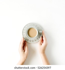 Girl's Hands Holding Coffee Cup. Flat Lay, Top View