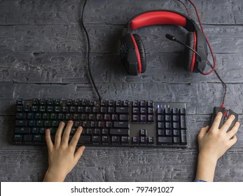 Girls Hands On A Computer Keyboard With Mouse On Dark Desktop.