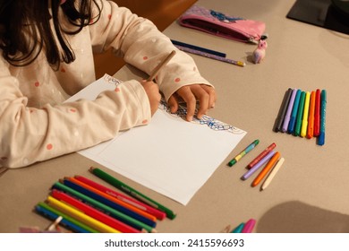 Girl's hands starting to draw with her colors - Powered by Shutterstock