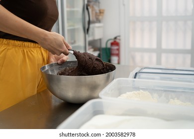 A Girl's Hands Stir An Appetizing Chocolate Mixture In A Metal Bowl In A Kitchen. Concept Of Cooking, Pastry.