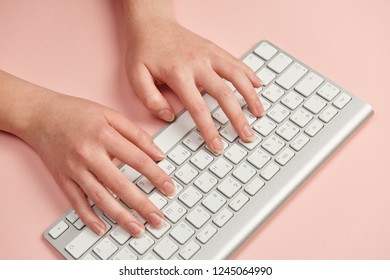 The Girl's Hands Typing On A Bluetooth Keyboard