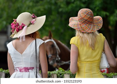 Girls With Hats Look At The Horse Racing, Derby