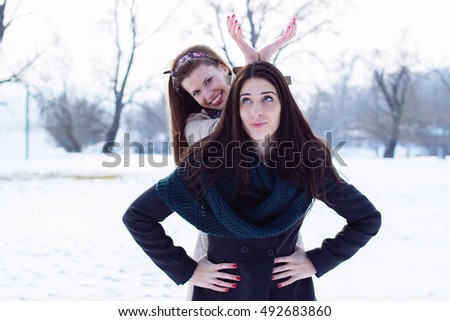 Girls having fun in the snow 