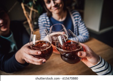 Girls Having Good Time,cheering And Drinking Cold Drinks, Enjoying Friendship Together In Coffee Shop, Close Up View On Hands  