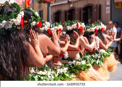 Girls in hawaiian costumes dance