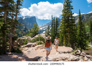 Girls Hikers On Summer Vacation Trip In The Mountains. People Hiking On Emerald Lake Trail. Estes Park, Rocky Mountains National Park, Colorado, USA.