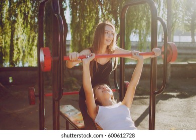 Girls Involved In Sports And Fitness In Park