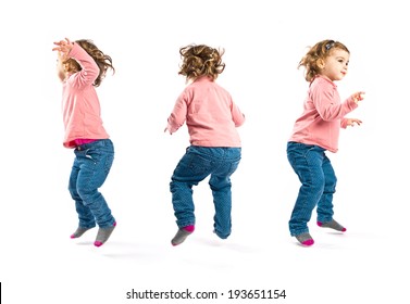 girls jumping over isolated white background