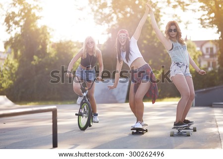 Similar – Happy young people having fun with skateboard and bicycle