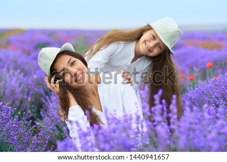 girls are in the lavender flower field, beautiful summer landscape