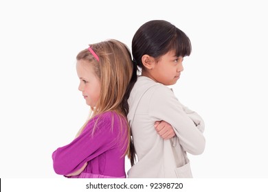 Girls mad at each other against a white background - Powered by Shutterstock