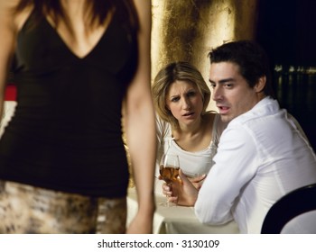 girls night out: horny guy looking at a nice girl passing by...while dining out with his girlfriend!
