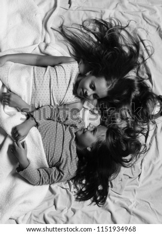Image, Stock Photo Relaxed mother and sons embracing lying in the bed