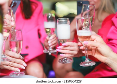 Girls In Pink Clothes In A Limo Drinking Champagne