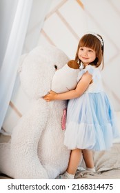 Girls Playing On The Bed With A Big Soft Toy Teddy Bear