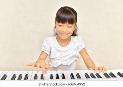 Girls playing piano