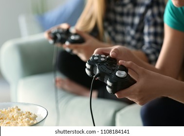 Girls Playing Video Games At Home, Closeup