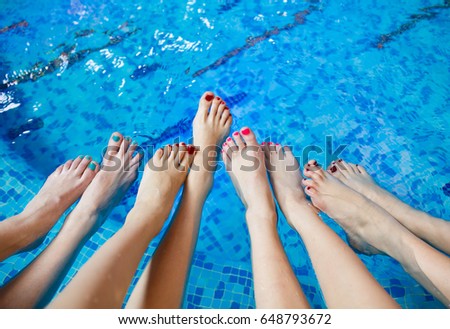 Girls relaxing in swimming pool.