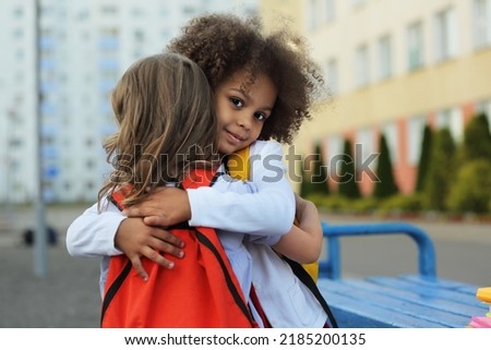 girls school friends support each other, hug and help to survive emotions after the school