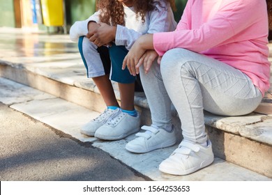 Girls Sit Together In A Break At The Primary School Playground