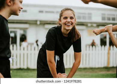 Girls stretching on the field - Powered by Shutterstock