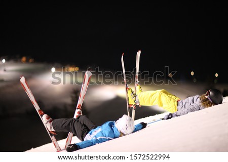 Similar – A teenage boy stretches down, pulling his head to his knees, outdoors