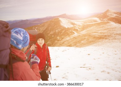 Girls are traveling through the mountains. - Shutterstock ID 386630017