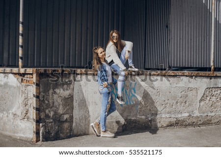 Similar – Couple of tourists walking down the street