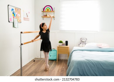 Girly Bedroom. Beautiful Little Kid Practicing And Studying At Home To Become A Ballerina