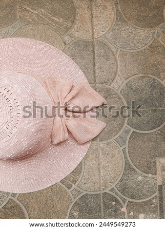A girly boater hat adding a touch of style to any outfit