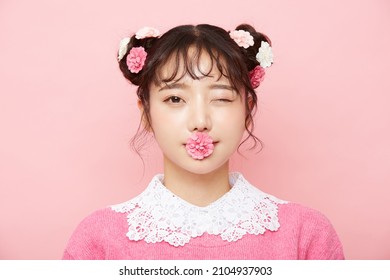 Girly Portrait Of Young Asian Woman On Pink Background